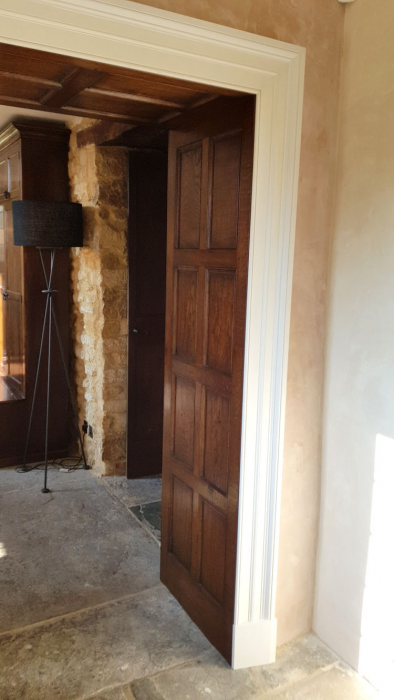 Oak Wall Panelling with Large painted Architrave